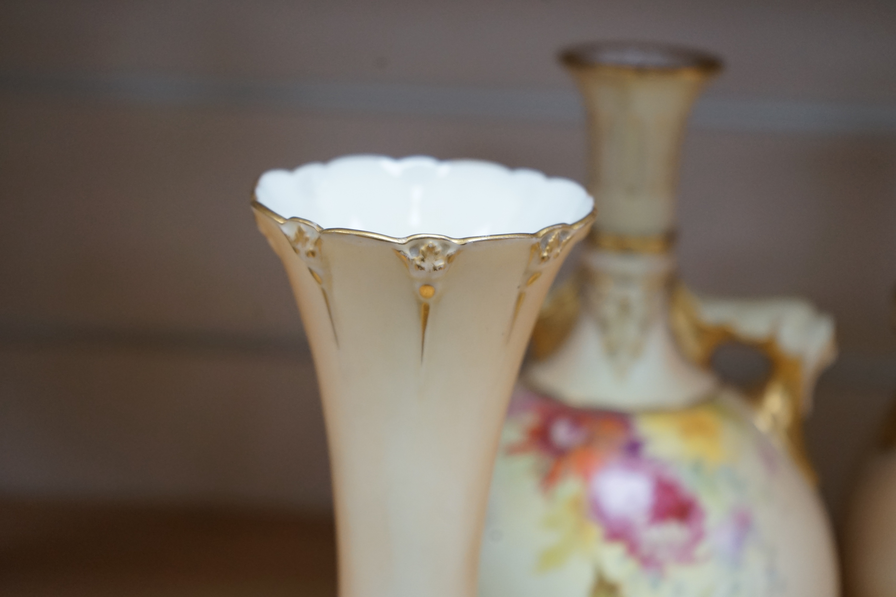 Two pairs of Royal Worcester blush ivory vases, model numbers 2332 and 1626 and Vienna type coffee can with saucer, tallest 22cm. Condition - good